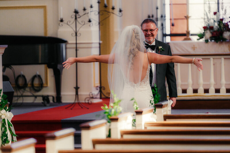Bride doing a first look with her dad at Brentwood Methodist Church 