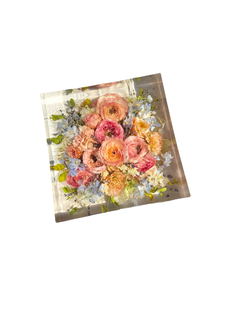 bright flowers arranged on wedding cake