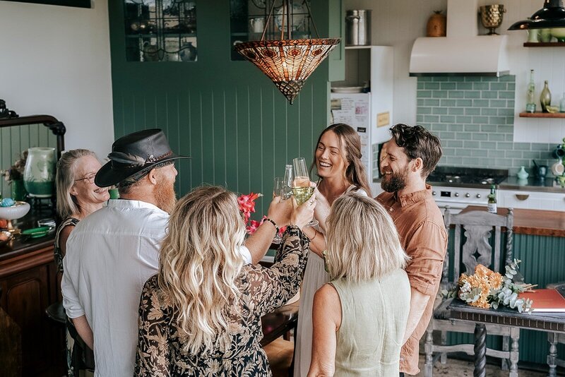 A group of friends making a toast with wine glasses