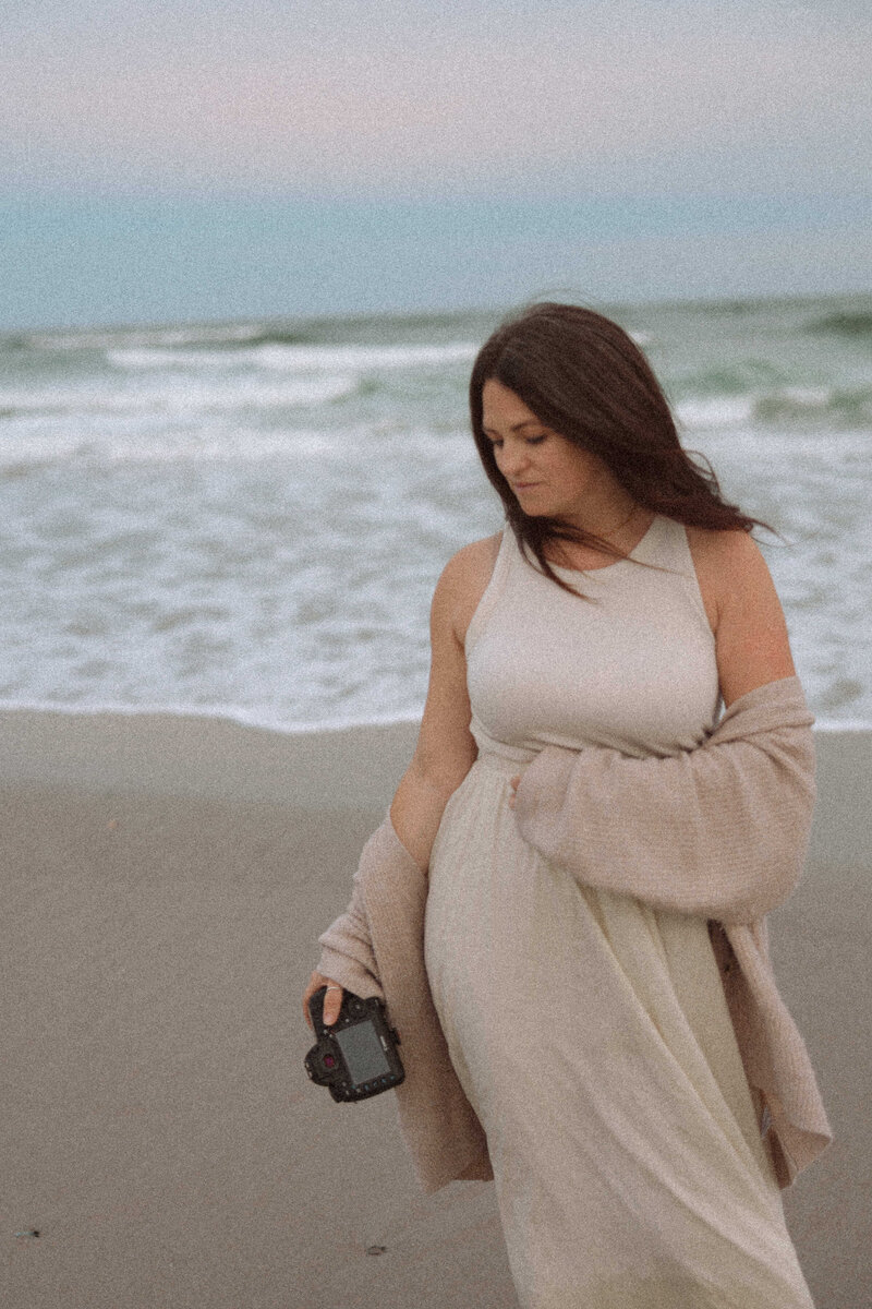 commercial photographer standing on beach for photography
