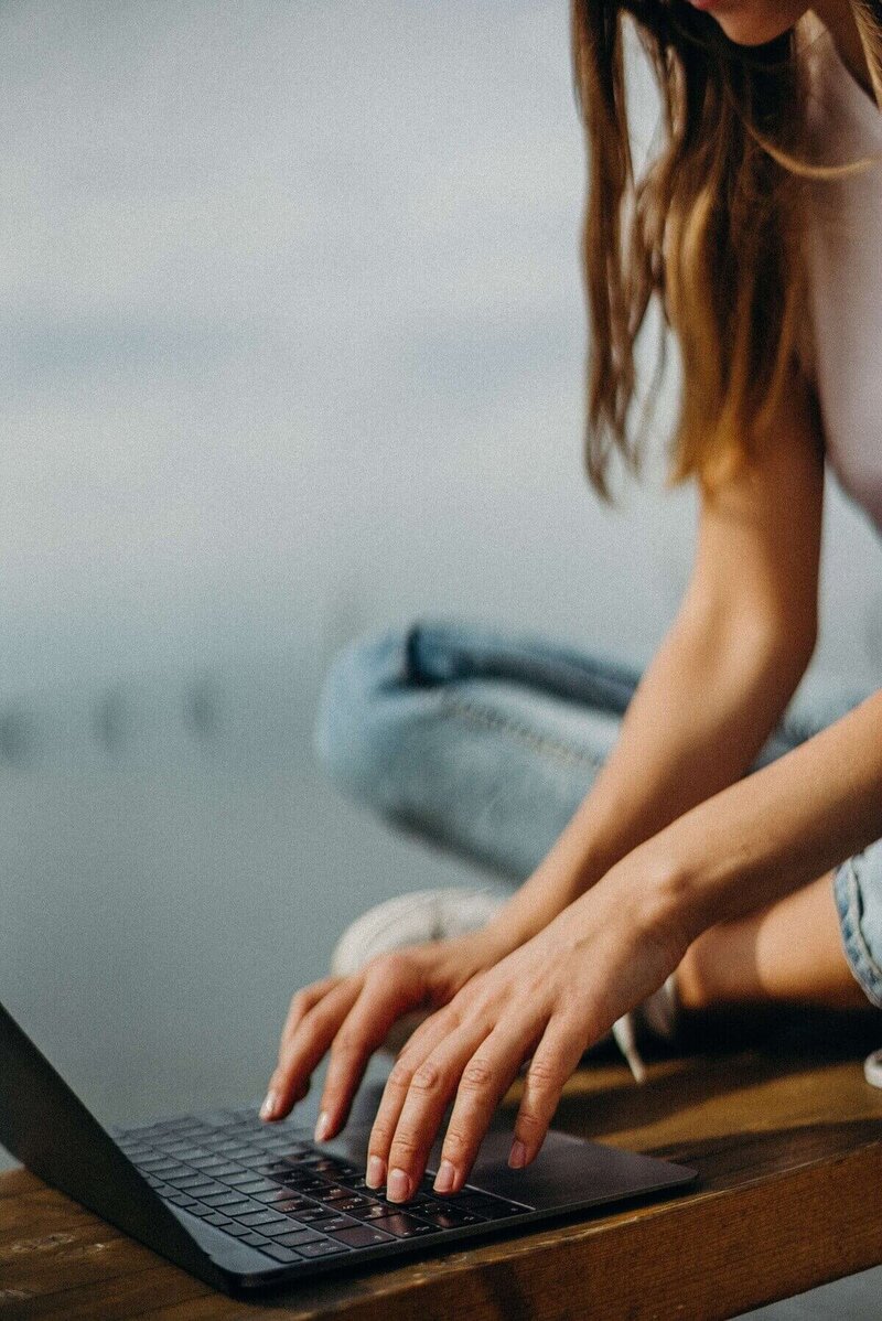 Woman sitting at laptop working