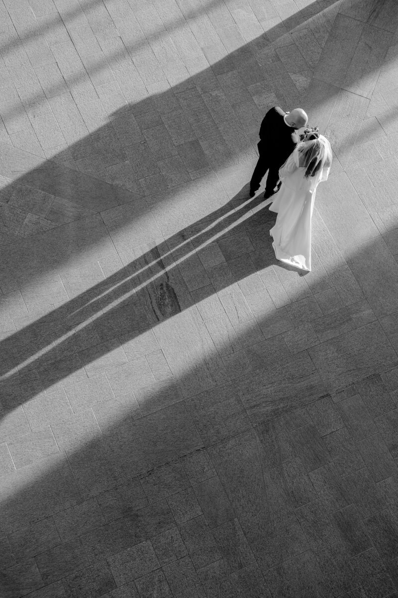 Bride and groom walk up memorial steps at their DC wedding
