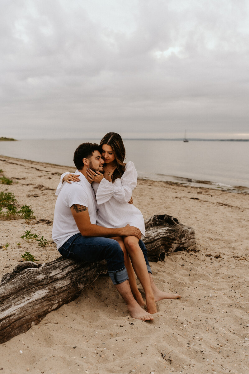 woman sitting on a man's lap embracing each other