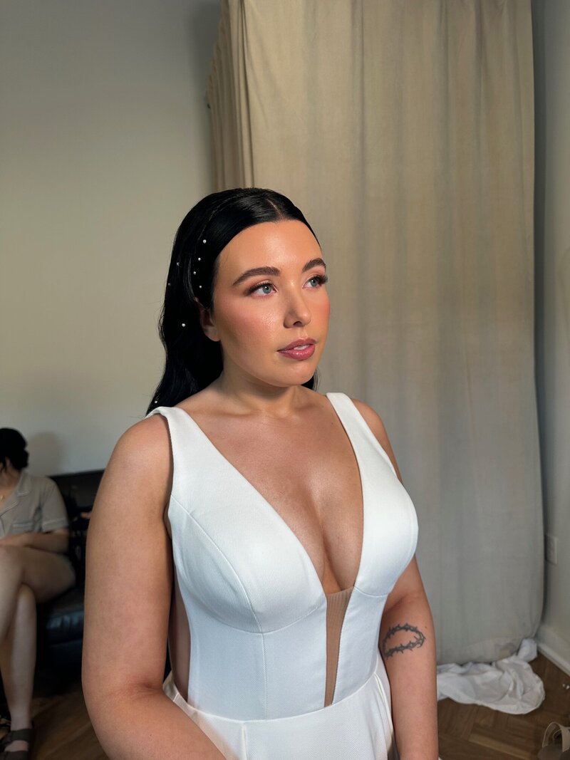 Bride showing off her styling from one of our bridal makeup packages.