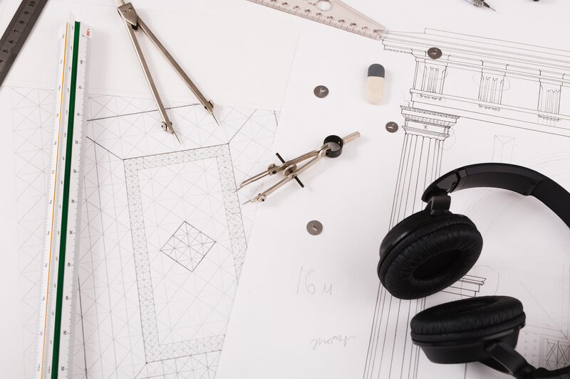 Headphones sitting on top of architectural project