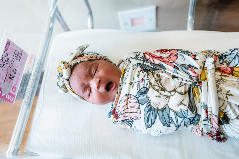Newborn baby swaddled in hospital bassinet during Fresh 48 session — natural lifestyle newborn photography in Weatherford by Poppy + Blue Photography