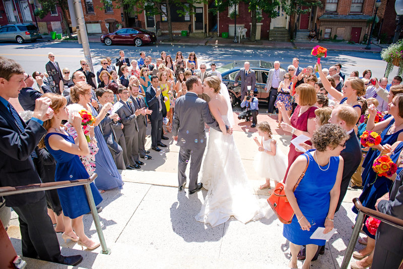 JandDstudio-wedding-photogrphy-york-pa-leaving-cathlic-church-bubles- kiss