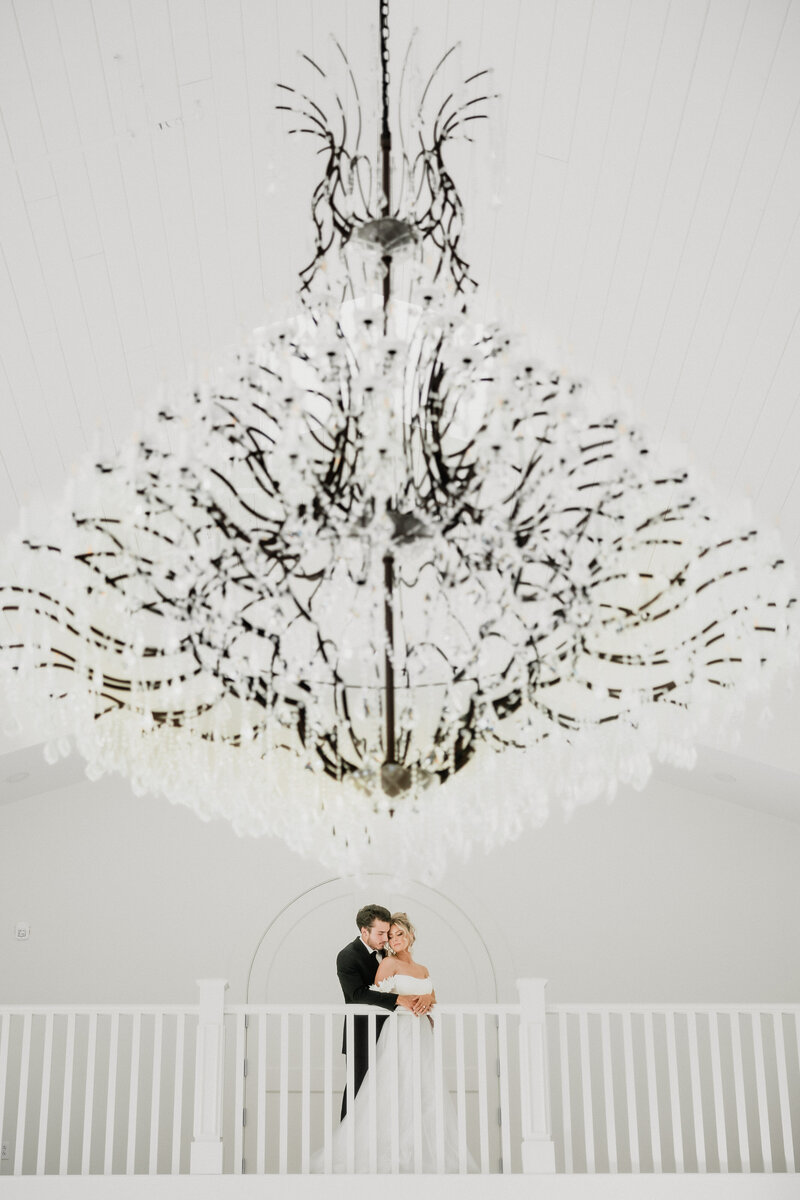 Bride and Groom embrace during their wedding at the Westwind Hills wedding venue in Pacific, Missouri.