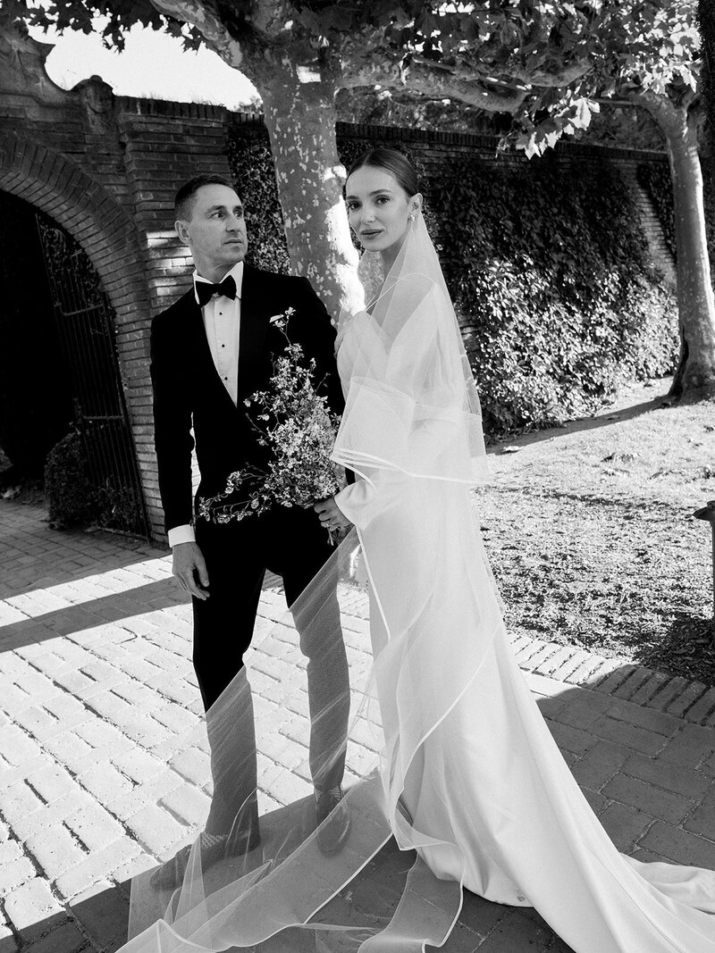 Bride in Monique Lhuillier walks with her father down the aisle at her wedding in Ravello at Villa la Rondinaia