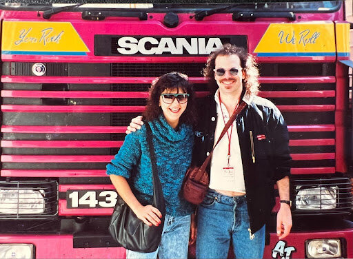 Melinda Fornero and husband Dan in front of a tour bus