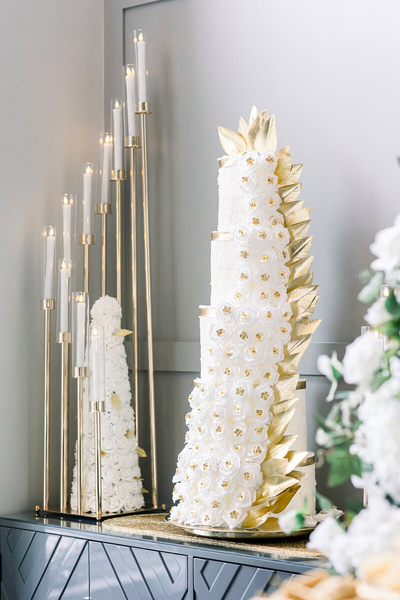 a gold and white wedding cake