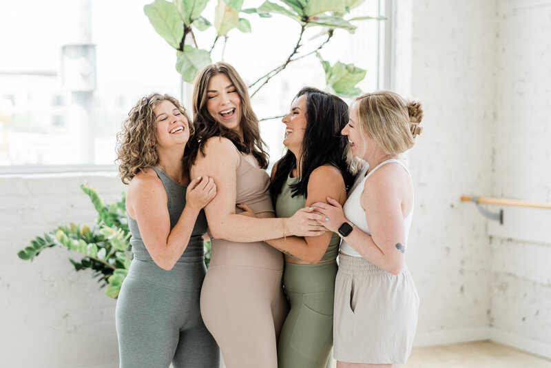 Woman holding each other smiling