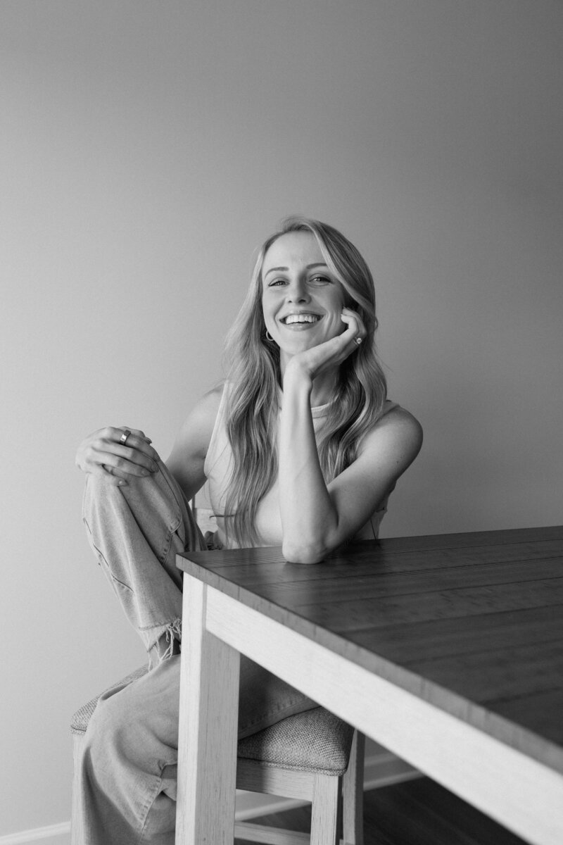 black and white photo of girl laughing