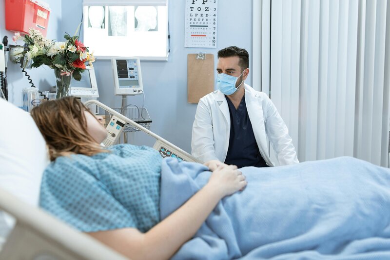 doctor talking to patient at bedside
