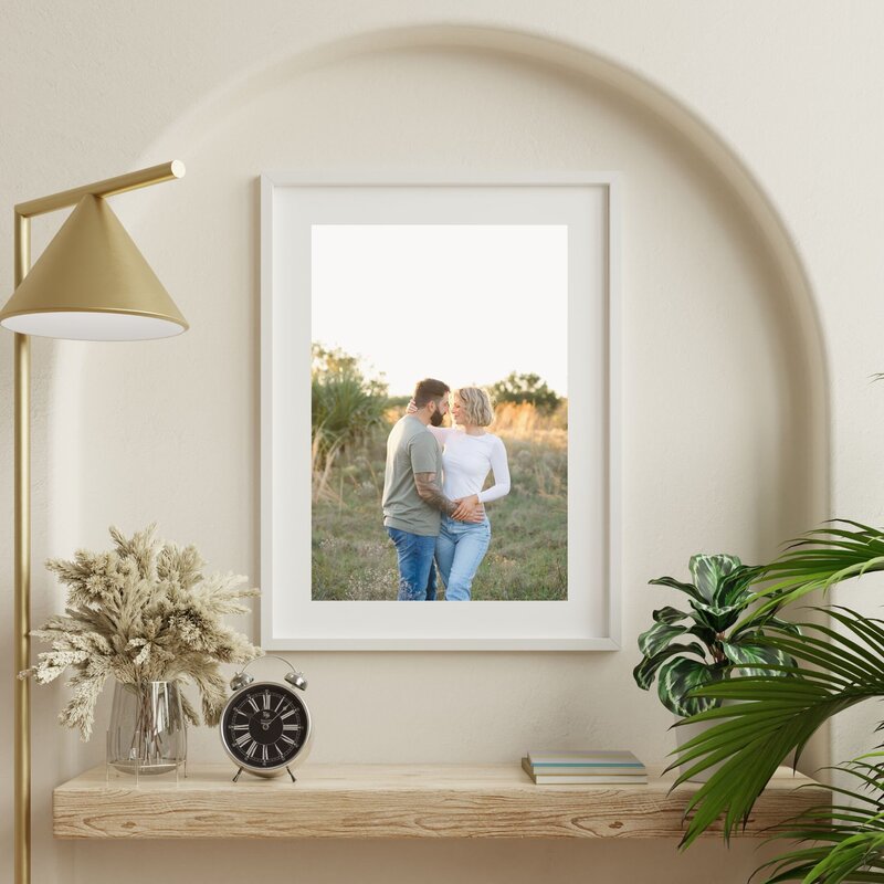 Beautiful artwork mock up of a couple admiring each other in a field at sunset