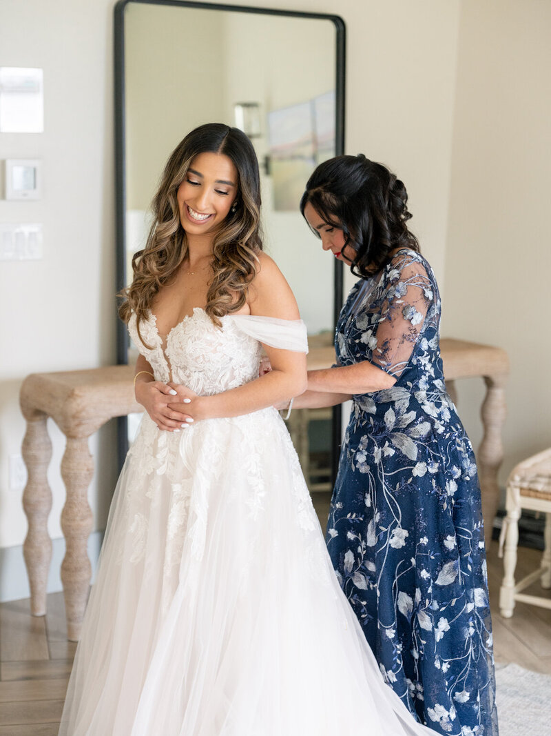 Bride getting ready in Canyonwood Ridge bridal suite with natural light and soft details