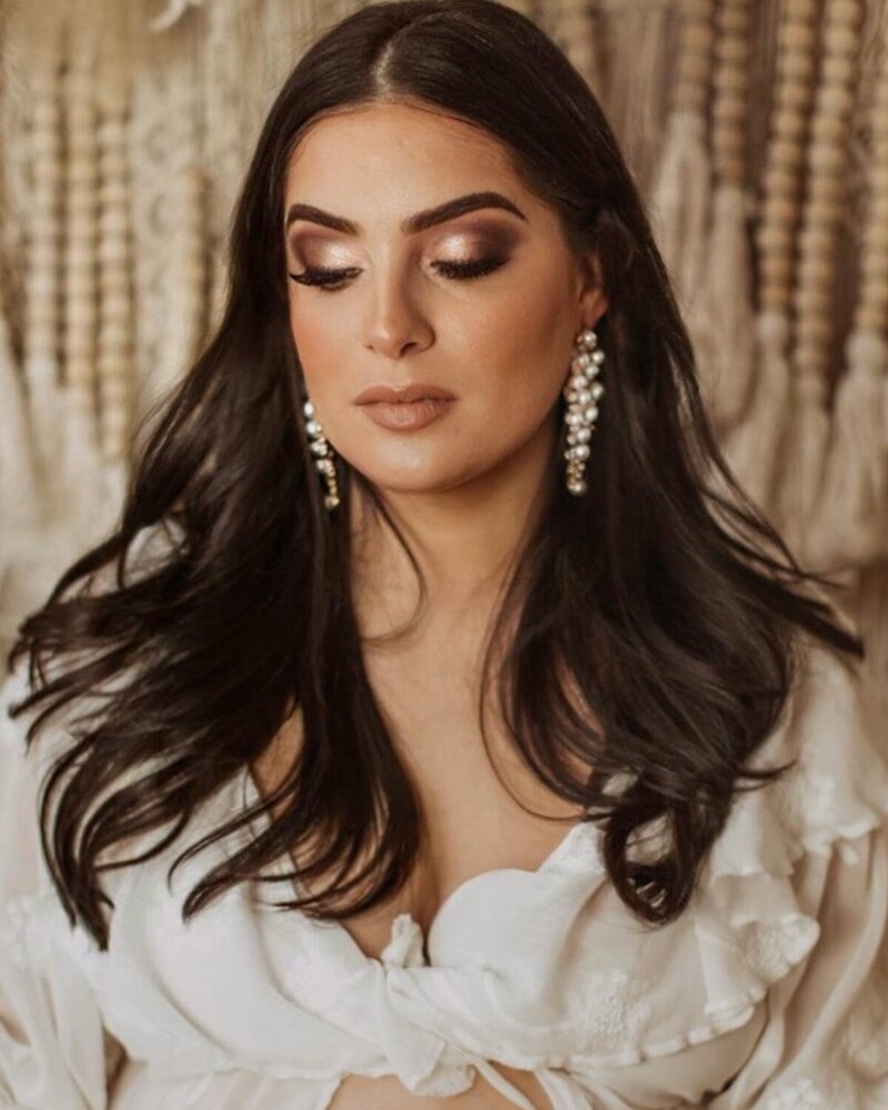 Romantic rose gold smokey eye paired with nude lips and soft waves—ideal for weddings, date nights, and bridal trials.