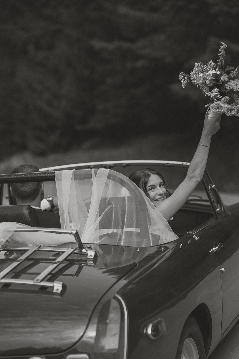 Bride and groom in their get away car during their wedding portraits in Victoria by latitude 49 photography