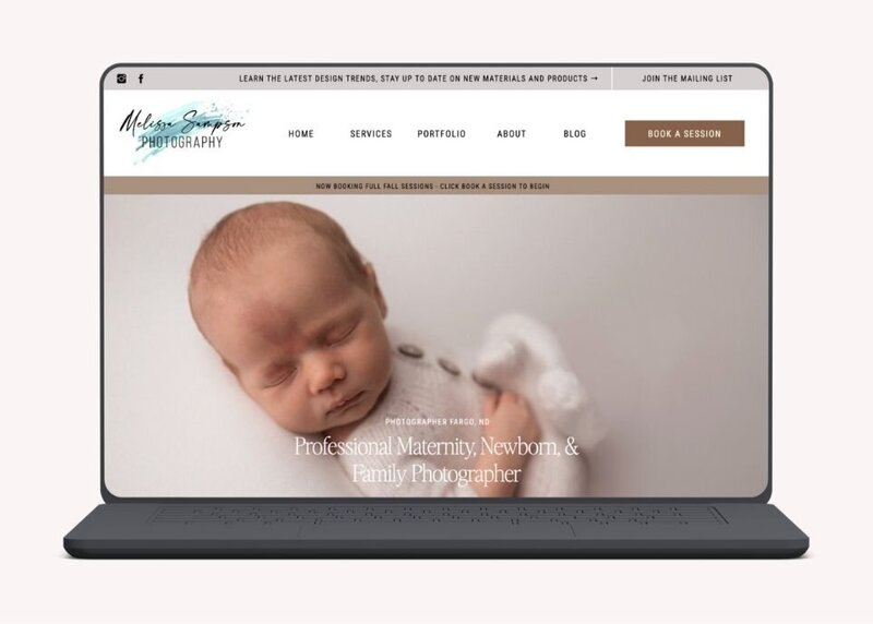 Website homepage showing newborn baby and text for maternity, newborn, and family photographer in Fargo.