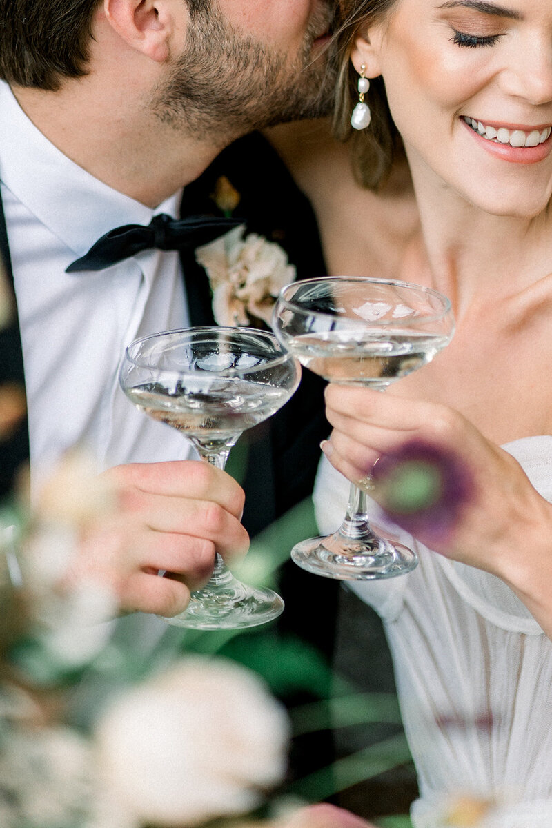 A joyful moment captured between newlyweds as they toast to their future. This image, taken by Tiffany Longeway Photography, reflects the happiness and elegance of weddings in the Bay Area.
