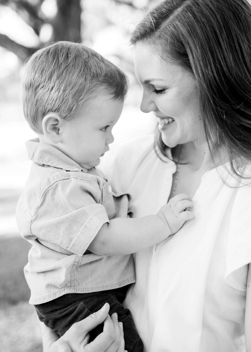 mom holds her little boy for a photo