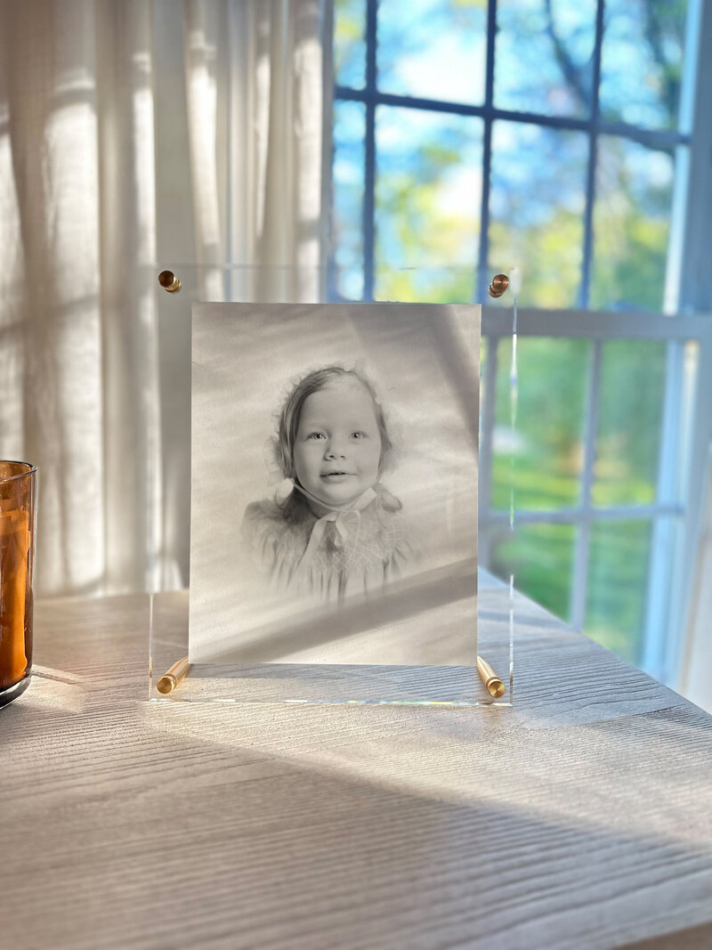 Framed black and white Heirloom Portrait of toddler girl with bonnet on by Tulsa Heirloom Photographer Caroline Eidson Portraits
