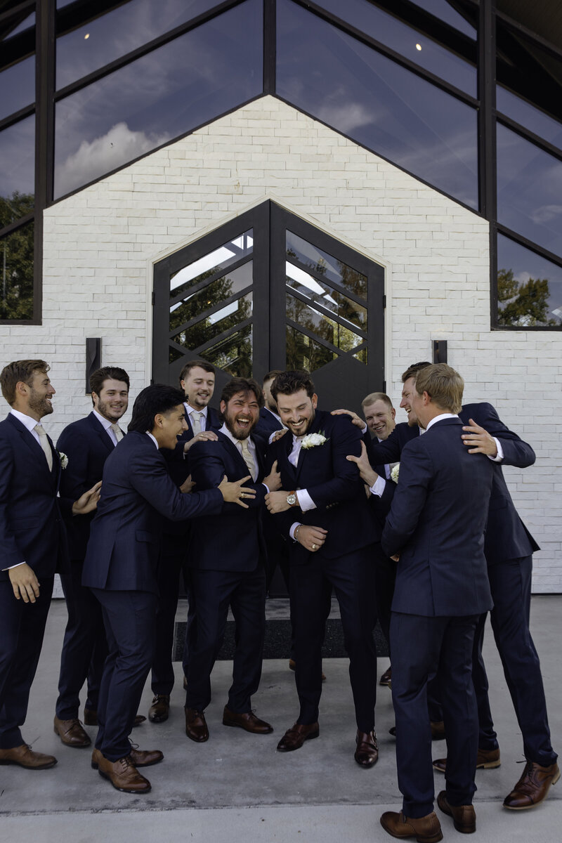 groomsmen pose during their texas wedding photos.