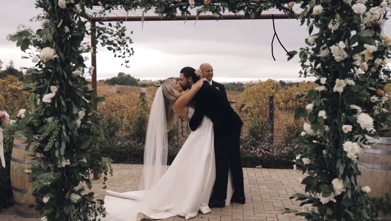 still of california wedding video bride and groom walking across venue