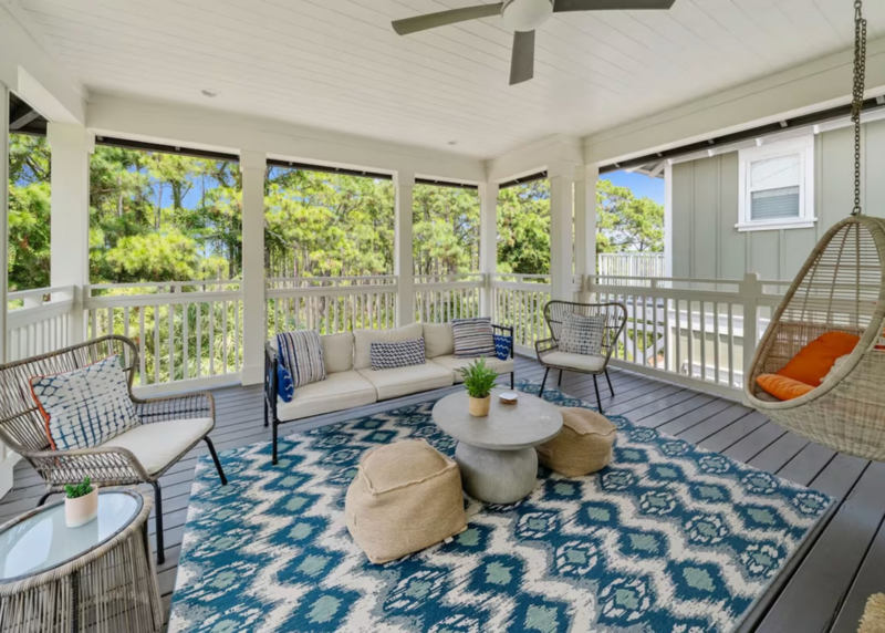 porch with blue and white rug, outdoor seating