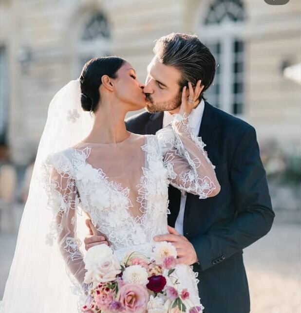 bride and groom sharing a kiss on their wedding day