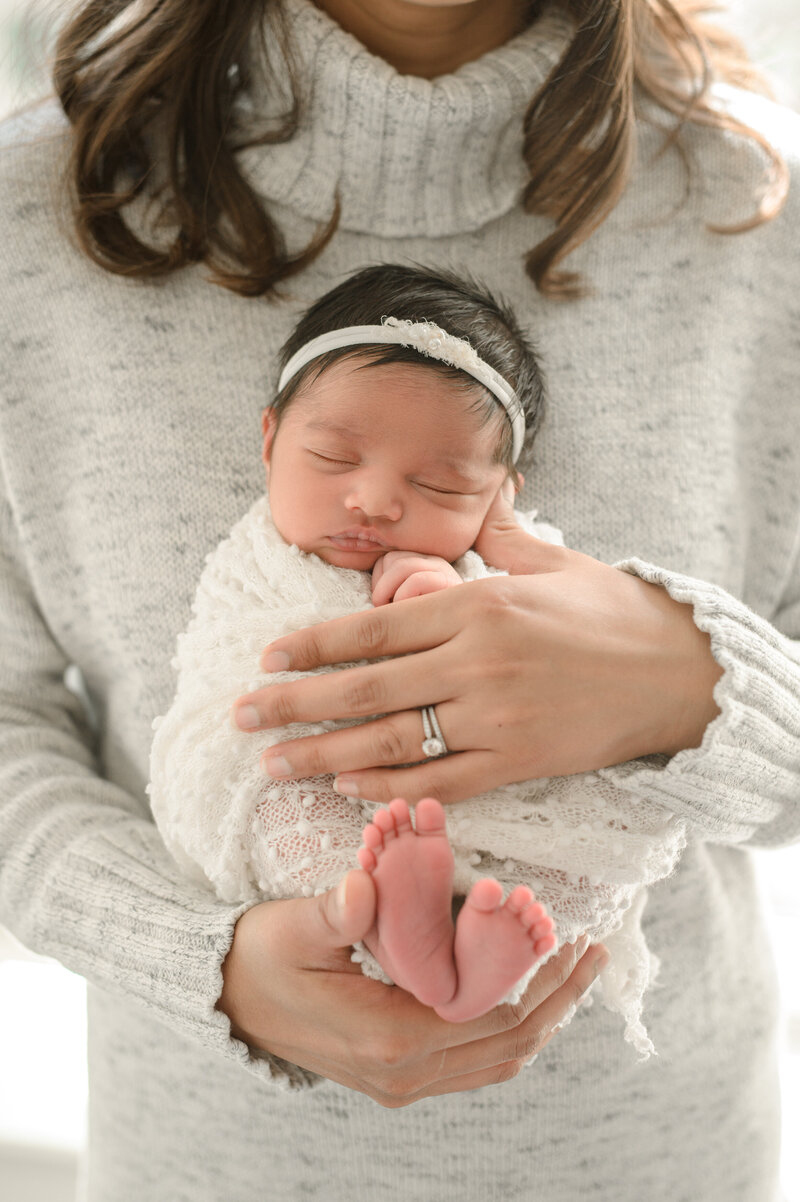 mom holding newborn baby