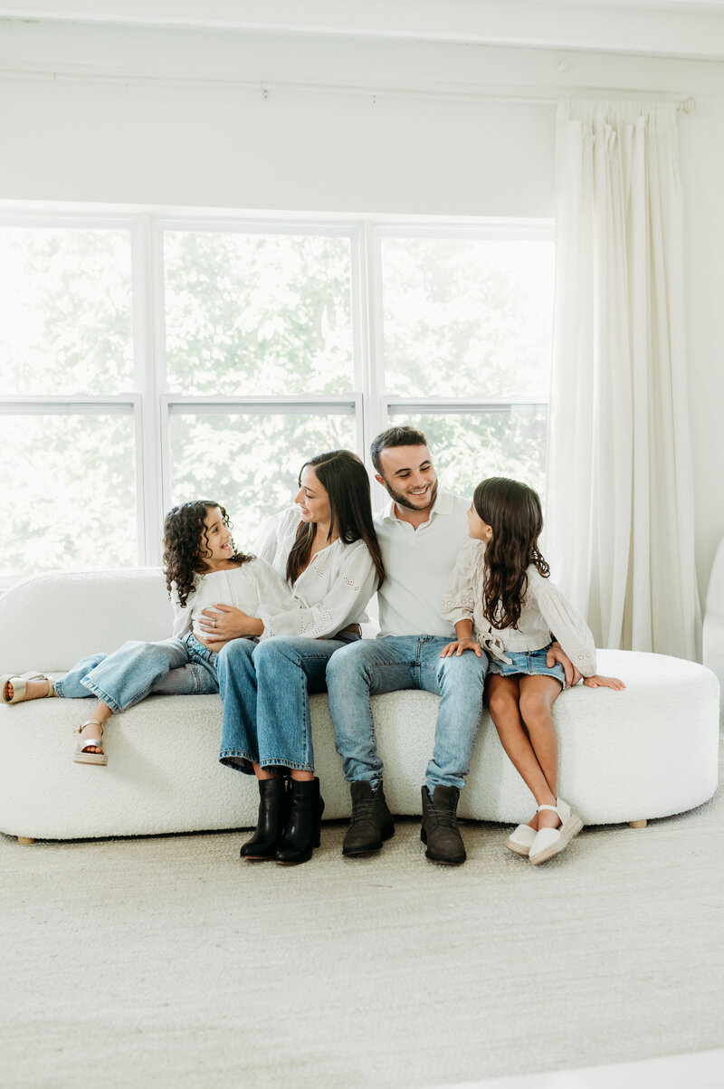 Mum and dad is looking at thirt daughter during their family session in Atlanta