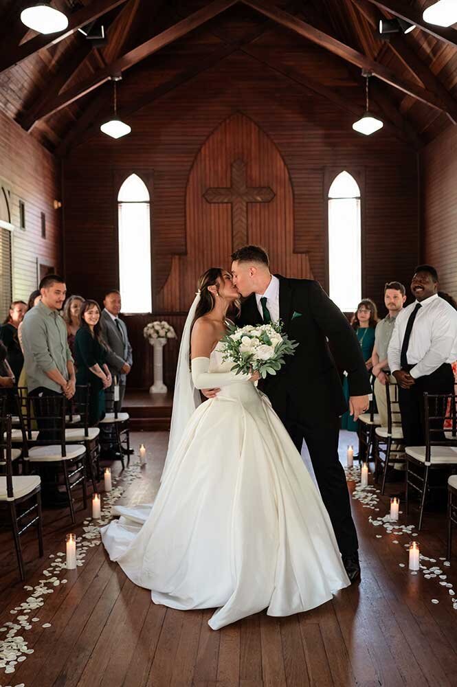 Elegant Jacksonville Bride and Groom kissing at alter - Wedding Photogrpher in Jacksonville Florida