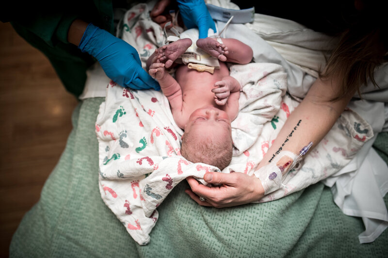 Newborn baby after birth check up