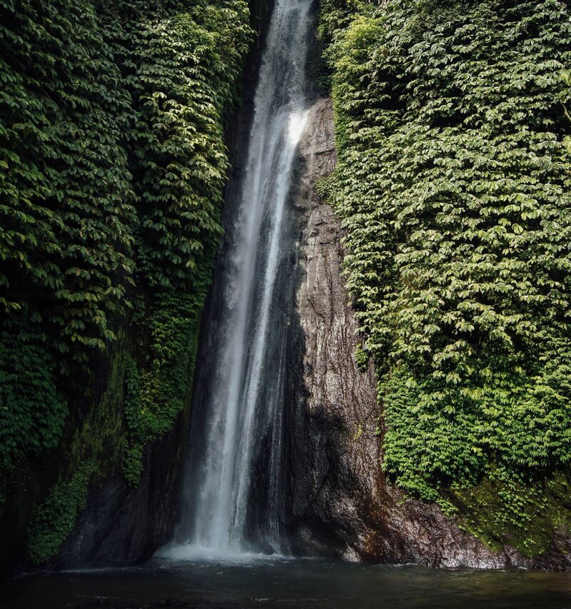 Waterfalls and coral reefs on a private diving vacation in Papua