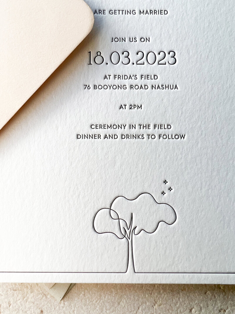 Celia letterpress  printed wedding invitation and envelope close up with tree