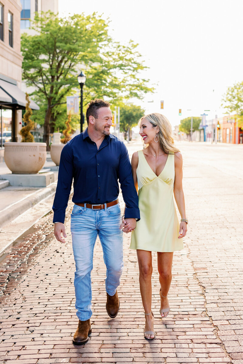 A couple walks the red brick streets of downtown Amarillo