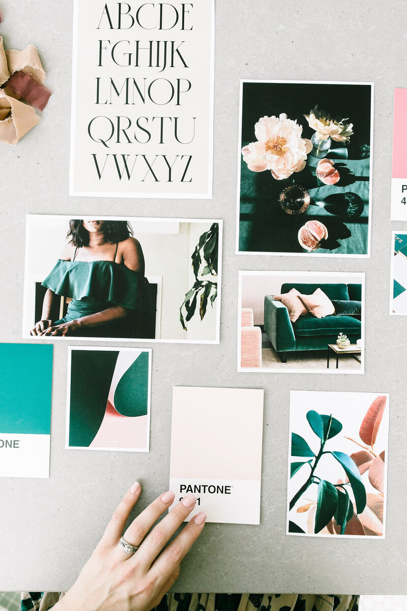 Flat lay of brand design inspiration with Pantone color cards, typography samples, and lifestyle photos arranged on a neutral background.
