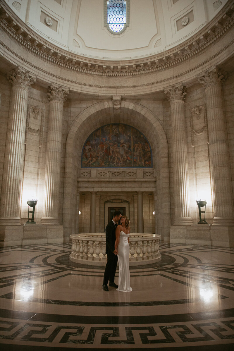 bride and groom hugging and smiling