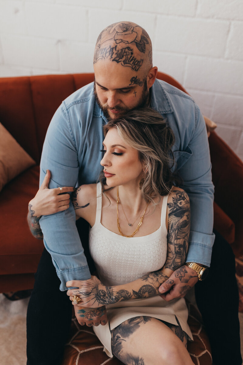 tattooed couple engaged