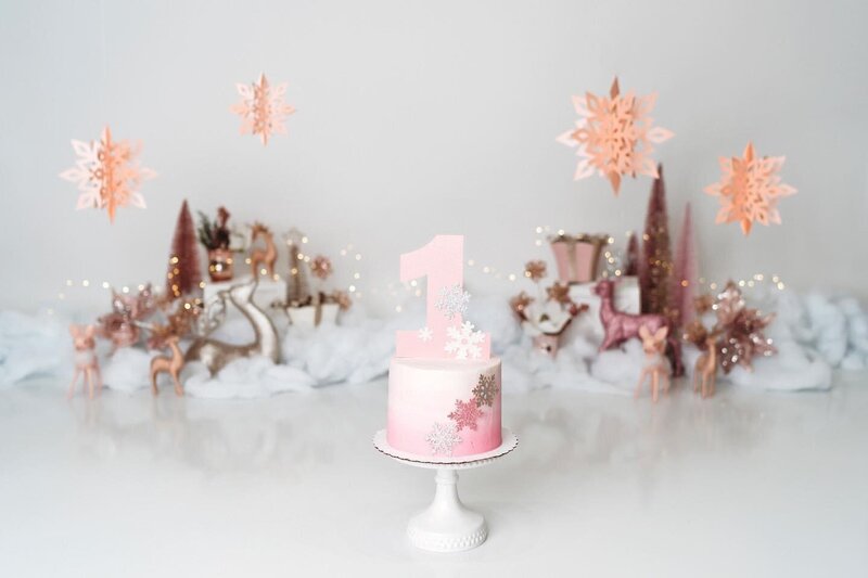 Winter wonderland pink one birthday theme with cake topper and pink trees