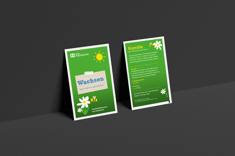 Mailingbeigabe für SOS-Kinderdorf – gebrandetes Kamillesamentütchen als Symbol für soziales Engagement.