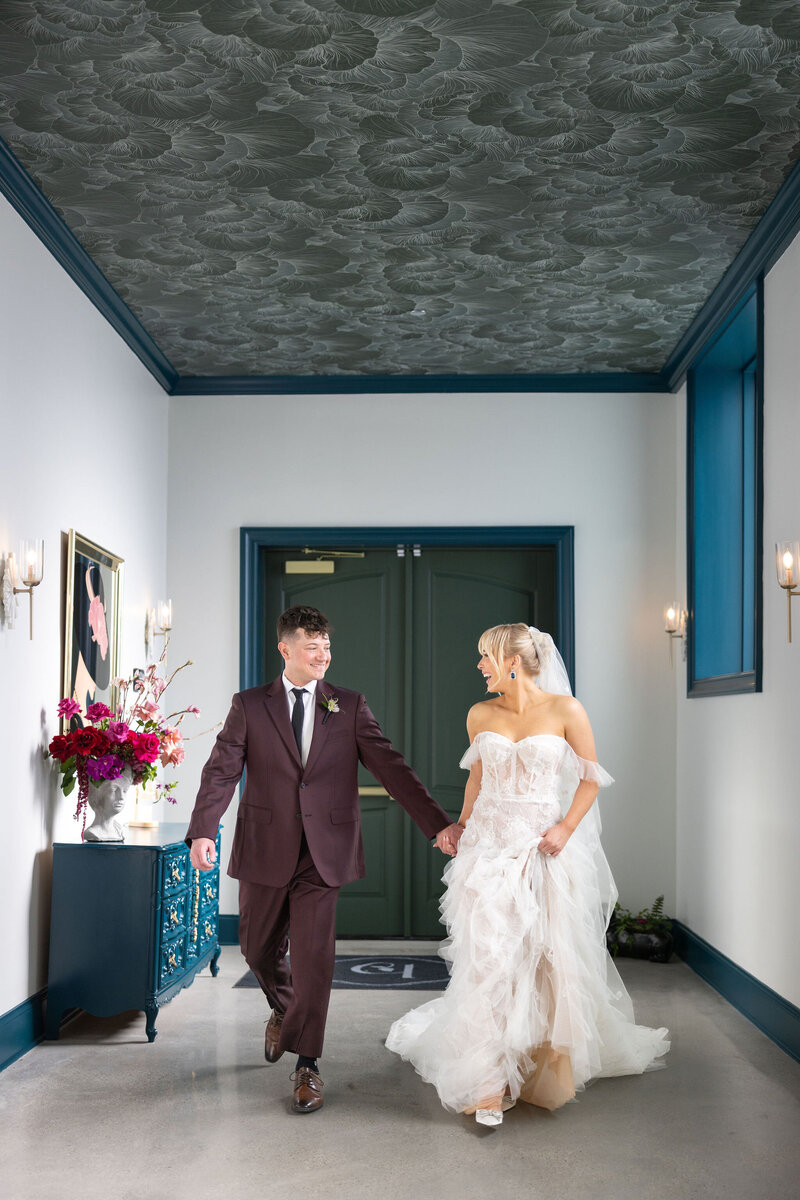 venue entrance with one-of-a-kind photo op, furniture, art pieces and overall design showing off personality of iconic space