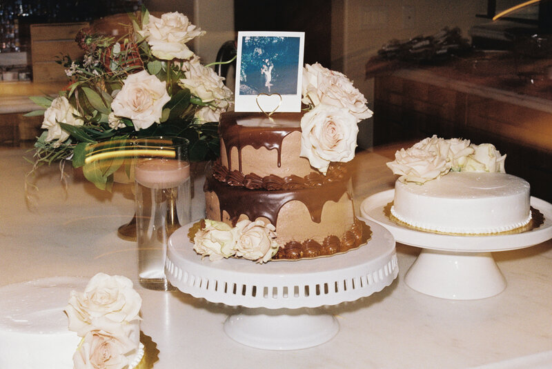 two tier cake with a polaroid cake topper wedding cake detail shot on 35mm film
