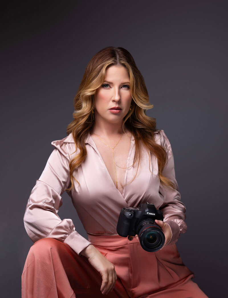 ohio boudoir photographer sitting holding camera
