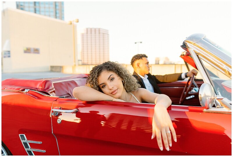 sexy red car, couple in a vintage mustang, editorial wedding couple, downtown engagement session