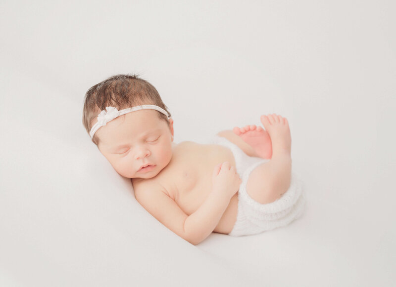 San Diego newborn photographer poses a sweet baby girl