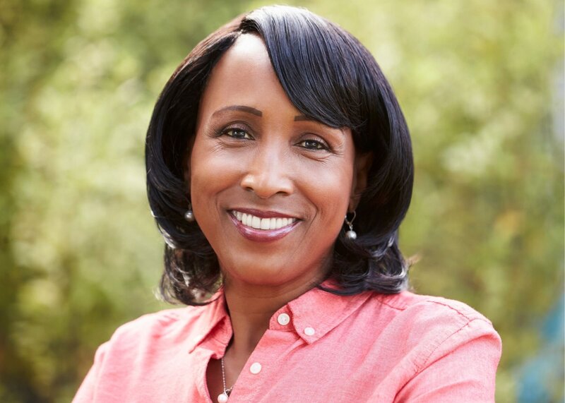 middle aged black woman smiling