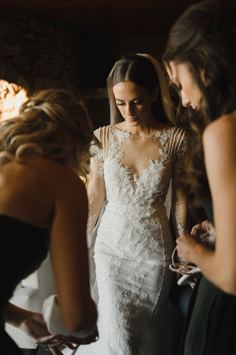 bride and groom driving in vintage car