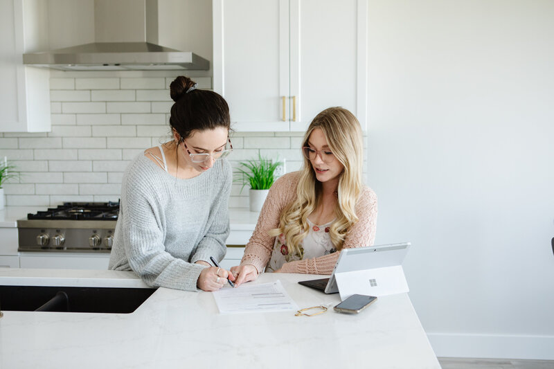 Realtor Tamara singing a representation agreement with a seller.
